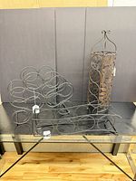 Overall view of three countertop racks and one bottle tower on table