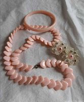 Necklace, bangle, earrings displayed together