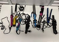 All seven styling tools laid out with cords