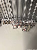 Full lot of boxed figurines lined against wall