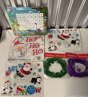 All items grouped: potty chart, three cling sheets, two tinsel garlands