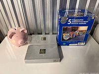 overall view showing piggy bank, two Mikasa boxes and pathway marker box