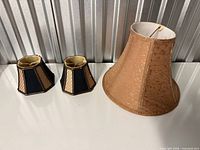 All three lamp shades together showing relative sizes and colors