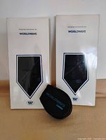 Two Worldways tie boxes and black Worldways Carrera sunglasses pouch