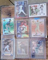 Group shot of all eight baseball cards in holders