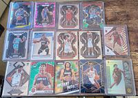 Group shot of all 14 sleeved NBA rookie cards