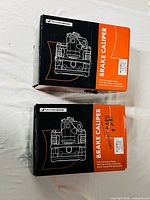 Two A-Premium brake caliper boxes