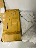 sealed plastic-wrapped set of pre-bent steel power steering lines alongside original A-Premium box