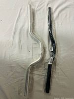 Both packaged handlebars side by side showing colors and curvature