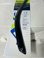 Packaged ventvisor showing full length of one deflector