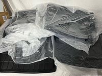 Set of floor mats inside clear plastic bags