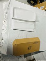 Two frosted acrylic panels on foam with box visible