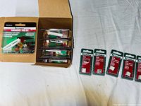 Open box showing multiple Littelfuse emergency fuse kits and loose JCASE fuse packs
