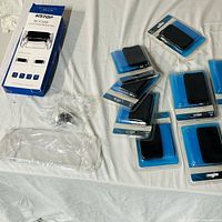 Group view of boxed hard plastic case, clear shell and multiple packaged silicone cases