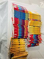 Stacked view showing volume and variety of paperback books