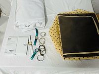 Group view showing packaged curtain, watch collection, phone case box and folded storage box
