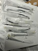 All nine packaged oil dip sticks on table