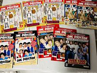 Group shot of all ten One Direction books showing cover types and quantities