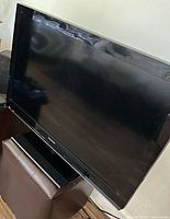 Front angled view of Panasonic 32" LCD TV on pedestal stand