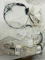 Group shot of five sealed hose assemblies
