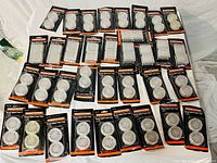 Tabletop view of all sealed caster cup packs