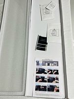 Full kit in foam tray with protector film, accessory packets and instruction sheet