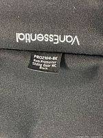 close-up of fabric storage panel with VanEssential logo and product tag