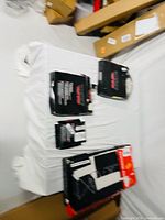 Three boxed automotive parts on table