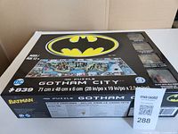 Front of sealed box showing Batman logo, puzzle image, piece count, dimensions.