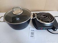 Berndes pot with lid beside Master Chef cooktop