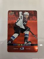 Front view of the Nathan MacKinnon Red Die-Cut trading card