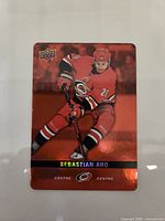 Front of the Sebastian Aho Red Die-Cut card showing player image and foil finish