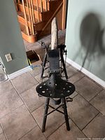 Top view showing seat, treadle linkage, and stone wheel