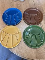 Top view of all four plates displaying colors and divided design