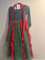 Full view of dress on hanger with tag visible
