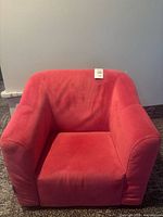Front view of pink velvet kids armchair