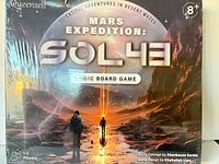 Front of sealed game box showing title, brand, age rating, players