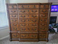 Front view showing all drawers, hardware and finish