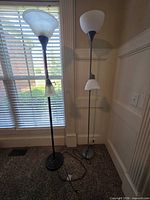 Both floor lamps standing side by side to show overall appearance, finishes and shades