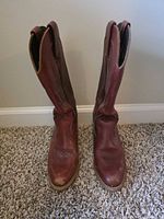 Front view of both boots upright on carpet