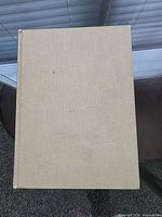 Front cover of beige clothbound hardcover book