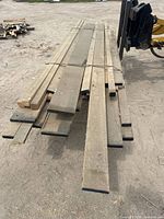 Top view of bundled hardwood boards strapped together