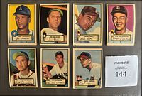 Fronts of seven 1952 Topps baseball cards arranged in two rows