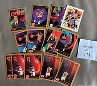 All 13 SkyBox basketball cards laid out