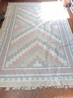 Full view of flatweave Dhurrie rug laid flat