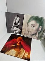 Front covers of all three Ariana Grande albums