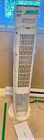 Full view of white tower air cooler with cord and base
