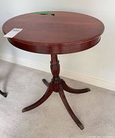 Oval mahogany side table front view showing top and legs