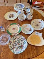 Overview of dinnerware and decorative plates on table