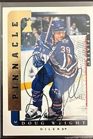 Front of Doug Weight autographed Pinnacle Be A Player card